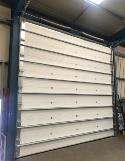 ผู้ส่งออกประตูม้วนกันไฟแบบแบ่งส่วนสำหรับโรงงานอุตสาหกรรมสถานีดับเพลิงพร้อมระบบล็อคความปลอดภัยสูง พร้อมระบบขึ้นรูปอัตโนมัติและระบบปลดฉุกเฉิน